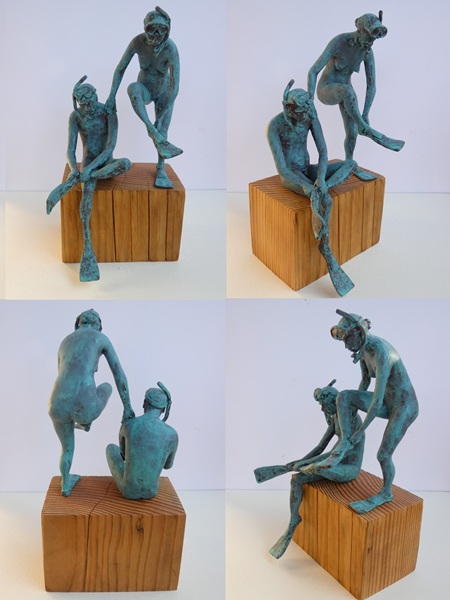 couple putting on fins